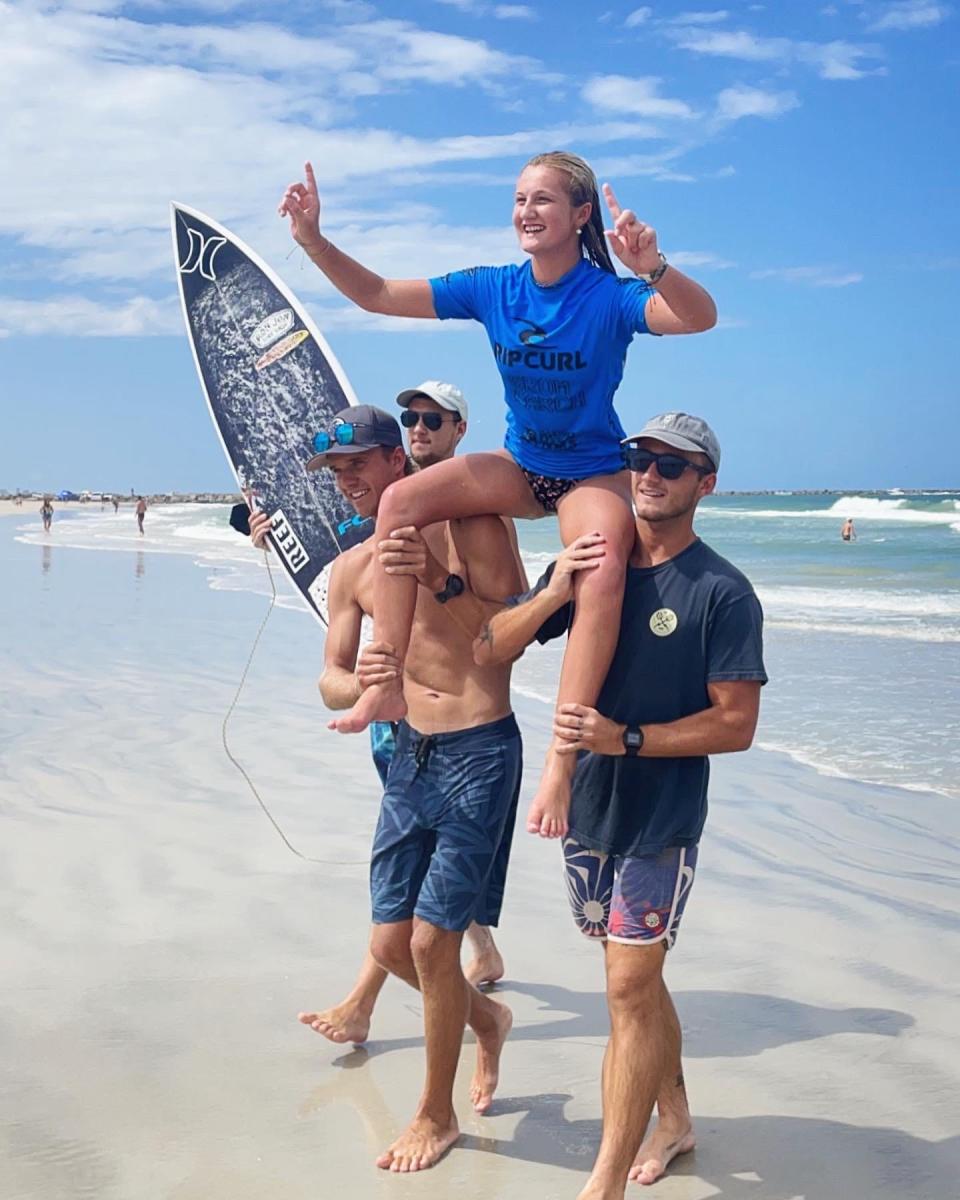 Kylie Pulcini of Melbourne is carried off the beach after winning the recent Rip Curl Grom Search contest in New Smyrna Beach, earning her a trip to California to surf in Kelly Slater's wave pool.