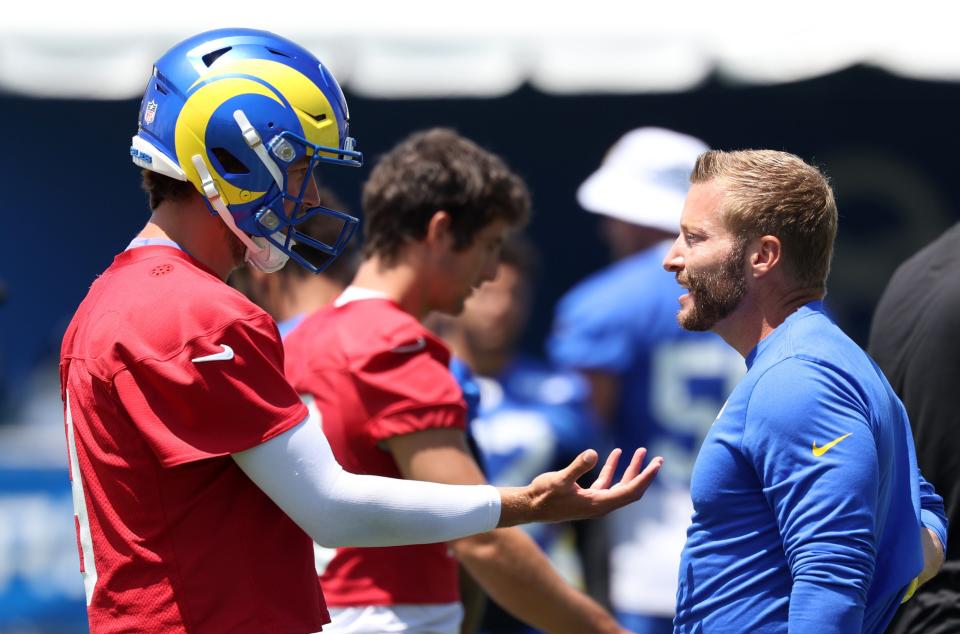 Jul 31, 2024; Los Angeles, CA, USA; Los Angeles Rams quarterback Matthew Stafford (9) and head coach Sean McVay talk during training camp at Loyola Marymount University. Mandatory Credit: Kiyoshi Mio-USA TODAY Sports