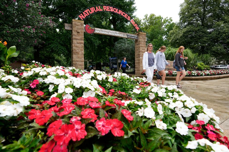 Visitors enter Natural Resources Park, which offers people the opportunity to try kayaking, fishing or archery.