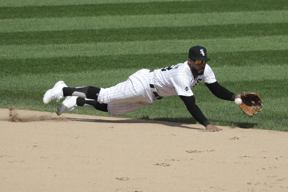 Chicago White Sox shortstop Leury Garcia tries to catch a single by Cleveland Indians' Jose Ramirez during the seventh inning of a baseball game in Chicago, Saturday, Aug. 8, 2020. (AP Photo/Nam Y. Huh)