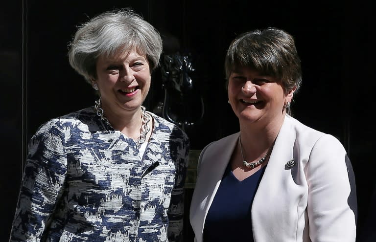 Britain's Prime Minister Theresa May (left) poses for a picture with Democratic Unionist Party (DUP) leader Arlene Foster at 10 Downing Street in central London on June 26, 2017