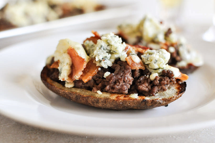 <strong>Get the <a href="http://tastykitchen.com/blog/2013/01/bacon-and-blue-cheeseburger-potato-skins/" target="_blank">Bacon And Blue Cheese Potato Skins recipe</a> by How Sweet It Is</strong>