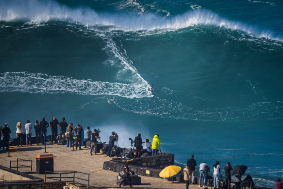 NAZARE, PORTUGAL - 2020/10/29: Big wave surfer Pedro Scooby from Brazil rides a wave during a tow surfing session at Praia do Norte on the first big swell of winter season. (Photo by Henrique Casinhas/SOPA Images/LightRocket via Getty Images)