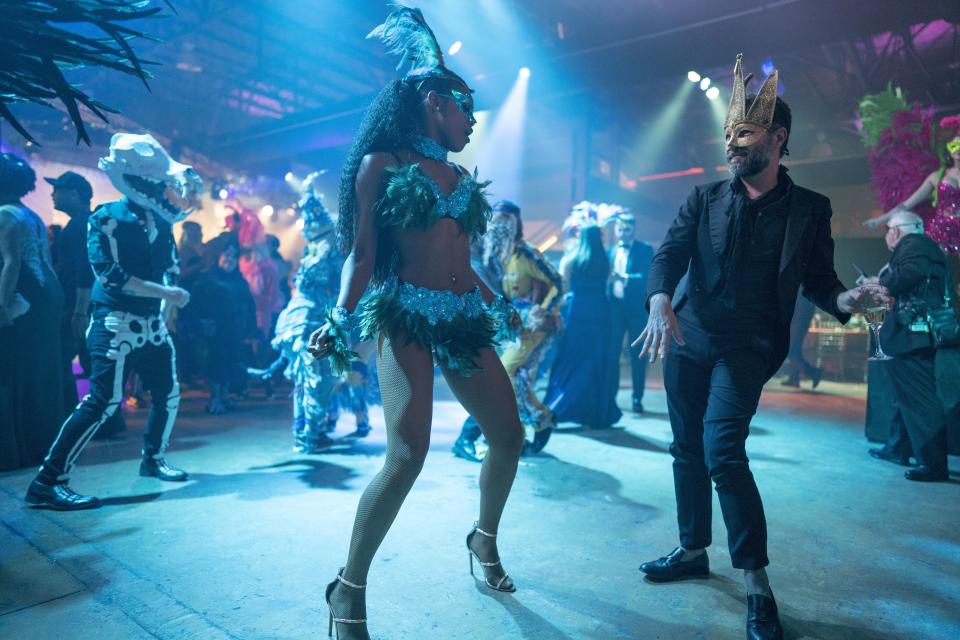 Dancers in costume at the Bal Masqué.