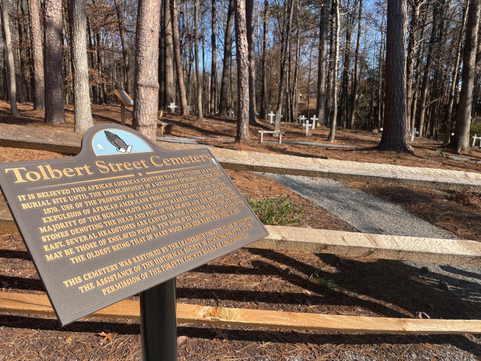 A sign at Tolbert Street Cemetery explains that the site was home to the Colored Methodist Episcopal Church until the violent removal of Forsyth's Black residents in 1912.