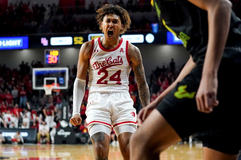 Cincinnati Bearcats guard Jeremiah Davenport (24) reacts after a made 3-point basket in the second half of a men's NCAA basketball game against the South Florida Bulls, Saturday, Feb. 26, 2022, at Fifth Third Arena in Cincinnati. The South Florida Bulls won, 54-52.