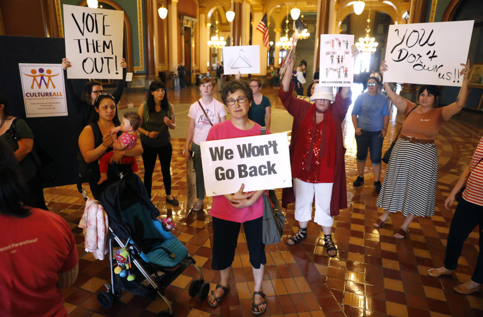 Protesters rally outside Iowa Gov. Kim Reynolds' formal office, Friday, May 4, 2018, at the statehouse in Des Moines, Iowa.  (Photo: Charlie Neibergall/AP)