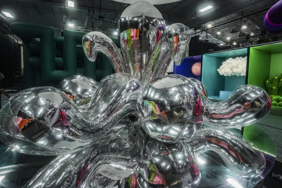 A silver inflatable "Octopus Balloon Tree" by artist Myeongbeom Kim, is installed as part of the Balloon Museum's U.S. exhibition "Let's Fly," at the museum's Manhattan's Pier 36 site, Tuesday, Oct. 24, 2023, in New York. The exhibition runs from Oct. 27, through Jan. 14. (AP Photo/Bebeto Matthews)