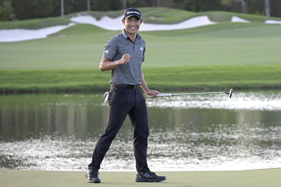 Collin Morikawa celebrates after putting on the 18th green to win the Workday Championship golf tournament Sunday, Feb. 28, 2021, in Bradenton, Fla. (AP Photo/Phelan M. Ebenhack)