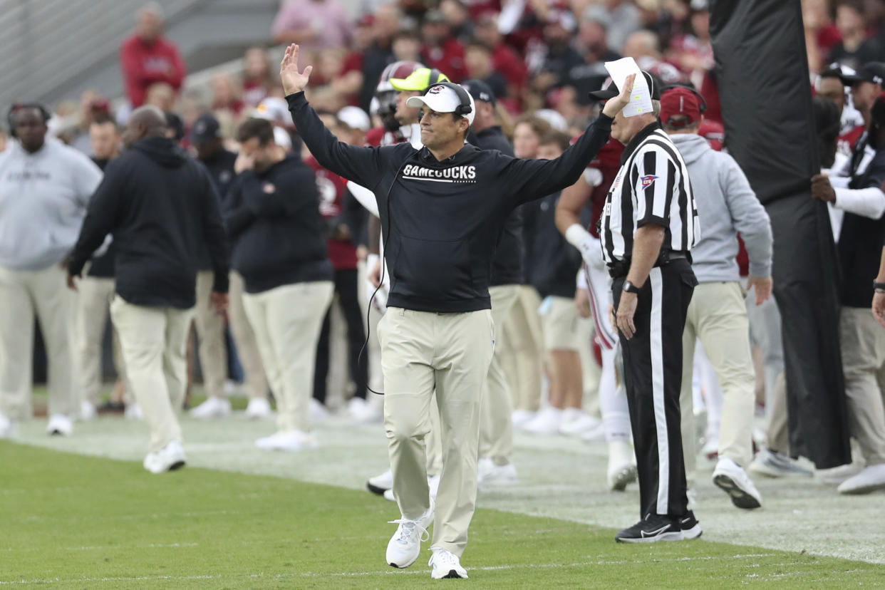 South Carolina head coach Shane Beamer raises his hands after a missed pass interference call during the first half of an NCAA college football game against Missouri, Saturday, Oct. 29, 2022, in Columbia, S.C. (AP Photo/Artie Walker Jr.)