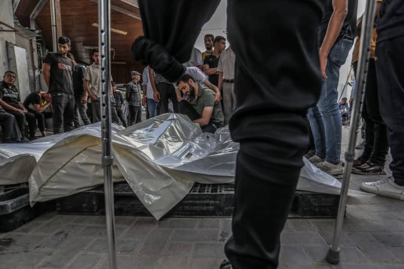 Palestinians bid farewell to their killed relatives at Al-Najjar Hospital, amid the ongoing conflict between Israel and the Palestinian militant group Hamas. Abed Rahim Khatib/dpa