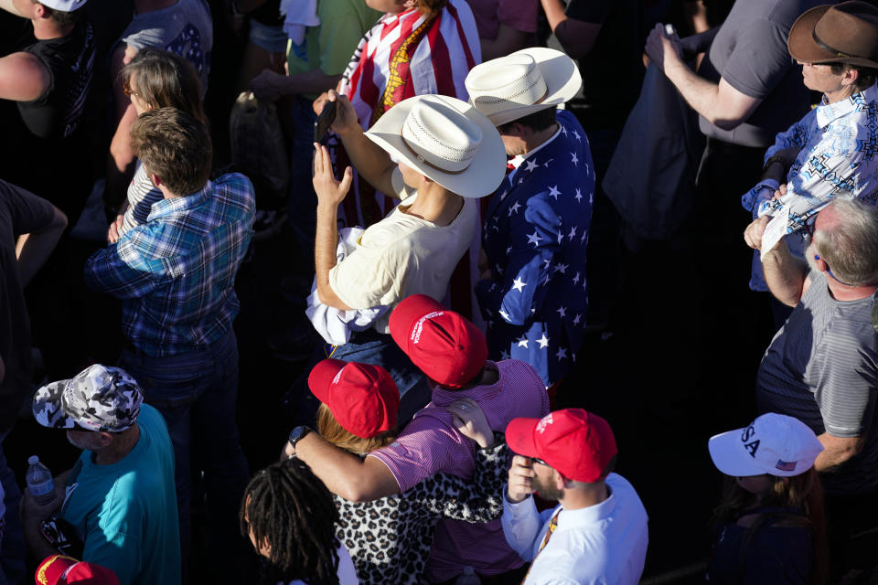 Supporters of former President Donald Trump listen as he speaks at a campaign rally at Waco Regional Airport, Saturday, March 25, 2023, in Waco, Texas. (AP Photo/Evan Vucci)