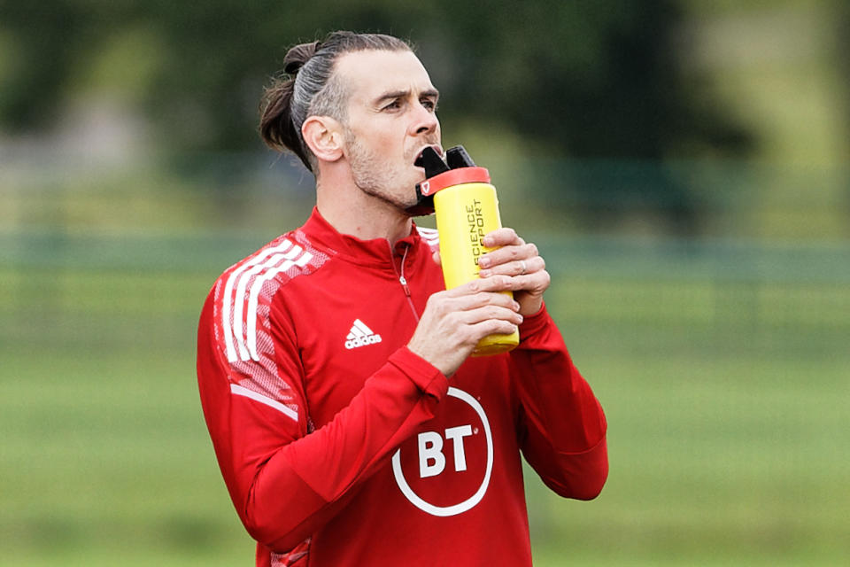 HENSOL, WALES - JUNE 04: Gareth Bale drinks water during a Wales Training Session at The Vale Resort on June 04, 2022 in Hensol, Wales. (Photo by Athena Pictures/Getty Images)