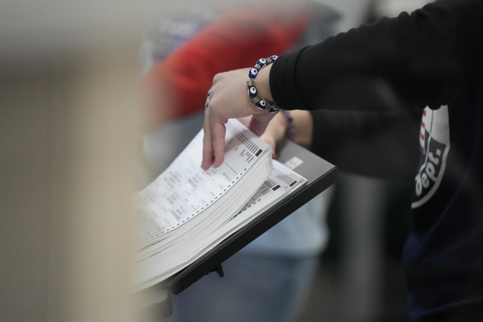 An election worker tabulates ballots at the Clark County Election Department Wednesday, Nov. 9, 2022, in Las Vegas. (AP Photo/Gregory Bull)