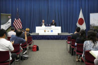 U.S. Ambassador to Japan Rahm Emanuel, center left, and Hiroshima Mayor Kazumi Matsui, center right, speak after signing the documents for a sister park arrangement between the Pearl Harbor National Memorial and the Hiroshima Peace Memorial Park at the U.S. Embassy Thursday, June 29, 2023 in Tokyo. (AP Photo/Eugene Hoshiko)