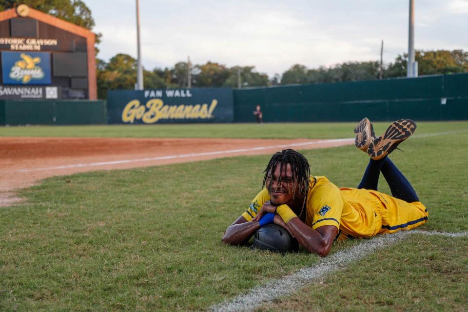 Savannah Bananas dancing first base coach Maceo Harrison relaxs in the box during a recent game at Grayson Stadium.