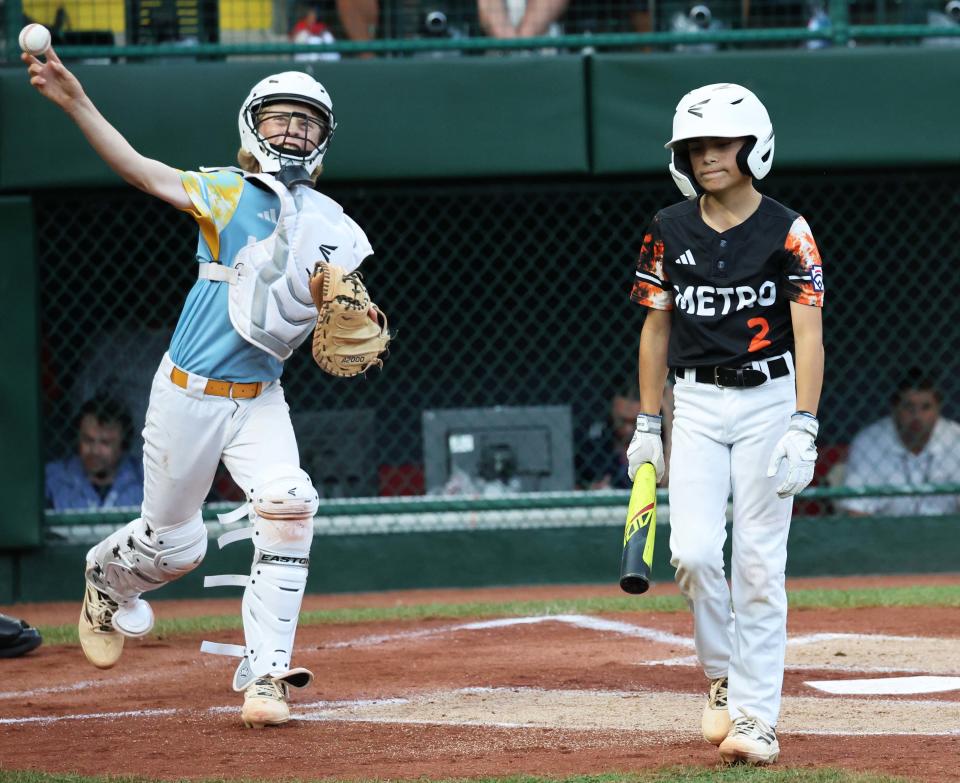 Smithfield batter Connor Queenan is called out on strikes as West Region champion El Segundo, California catcher Lucas Keldorf throws the ball around during a game at Howard J. Lamade Stadium in Williamsport, Pennsylvania on Tuesday.