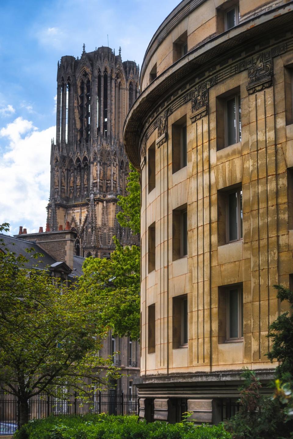 <div class="inline-image__title">1419851081</div> <div class="inline-image__caption"><p>Public Carnegie Library garden and front tower of Reims cathedral on square Place Carnegie, summer, Reims.</p></div> <div class="inline-image__credit">Sergii Zinko/Shutterstock</div>