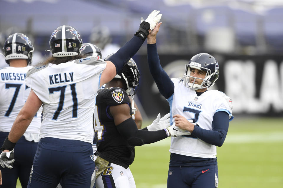 Tennessee Titans kicker Stephen Gostkowski, right, celebrates after kicking a field goal against the Baltimore Ravens during the first half of an NFL football game, Sunday, Nov. 22, 2020, in Baltimore. (AP Photo/Nick Wass)