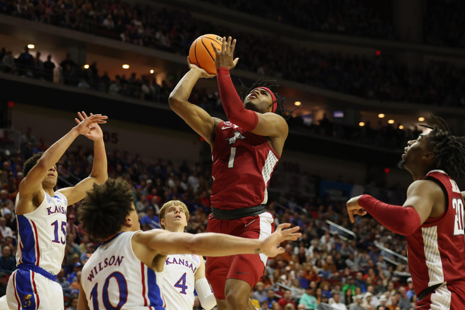 Mar 18, 2023; Des Moines, IA, USA; Arkansas Razorbacks guard <a class="link " href="https://sports.yahoo.com/ncaab/players/159594" data-i13n="sec:content-canvas;subsec:anchor_text;elm:context_link" data-ylk="slk:Ricky Council IV;sec:content-canvas;subsec:anchor_text;elm:context_link;itc:0">Ricky Council IV</a> (1) shoots the ball against Kansas Jayhawks guard Kevin McCullar Jr. (15) and forward <a class="link " href="https://sports.yahoo.com/ncaab/players/152795" data-i13n="sec:content-canvas;subsec:anchor_text;elm:context_link" data-ylk="slk:Jalen Wilson;sec:content-canvas;subsec:anchor_text;elm:context_link;itc:0">Jalen Wilson</a> (10) and guard <a class="link " href="https://sports.yahoo.com/ncaab/players/169704" data-i13n="sec:content-canvas;subsec:anchor_text;elm:context_link" data-ylk="slk:Gradey Dick;sec:content-canvas;subsec:anchor_text;elm:context_link;itc:0">Gradey Dick</a> (4) during the first half at Wells Fargo Arena. Mandatory Credit: Reese Strickland-USA TODAY Sports