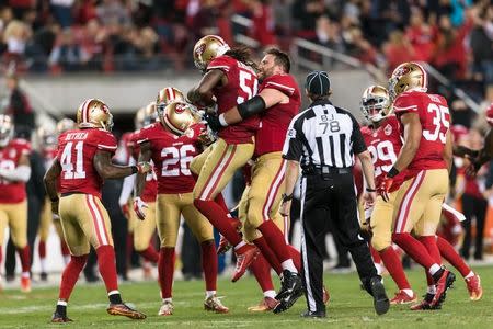 Sep 12, 2016; Santa Clara, CA, USA; iSan Francisco 49ers outside linebacker Ray-Ray Armstrong (54) reacts after intercepting a pass against the Los Angeles Rams in the third quarter at Levi's Stadium. The 49ers won 28-0. Mandatory Credit: John Hefti-USA TODAY Sports