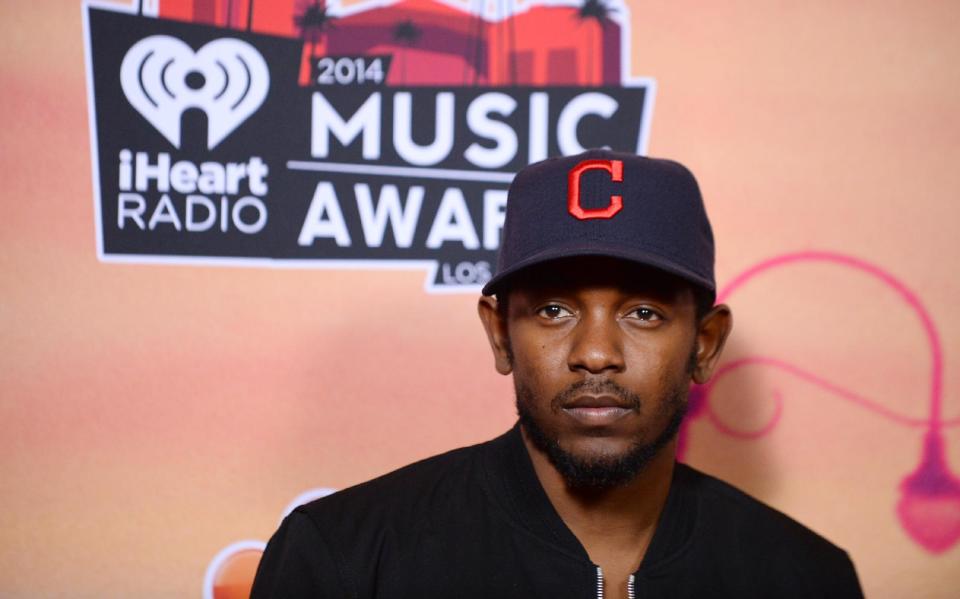 Kendrick Lamar poses in the press room at the iHeartRadio Music Awards at the Shrine Auditorium on Thursday, May 1, 2014, in Los Angeles. (Photo by Jordan Strauss/Invision/AP)