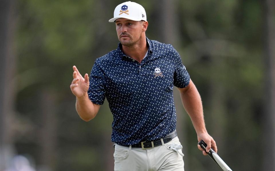 Bryson DeChambeau waves after making a putt on the third hole during the first round of the U.S. Open