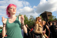 BERLIN, GERMANY - JULY 21: Attendees dance at the second annual Hipster Olympics on July 21, 2012 in Berlin, Germany. With events such as the "Horn-Rimmed Glasses Throw," "Skinny Jeans Tug-O-War," "Vinyl Record Spinning Contest" and "Cloth Tote Sack Race," the Hipster Olympics both mocks and celebrates the Hipster subculture, which some critics claim could never be accurately defined and others that it never existed in the first place. The imprecise nature of determining what makes one a member means that the symptomatic elements of adherants to the group vary in each country, but the archetype of the version in Berlin, one of the more popular locations for those following its lifestyle, along with London and Brooklyn, includes a penchant for canvas tote bags, the carbonated yerba mate drink Club Mate, analogue film cameras, asymmetrical haircuts, 80s neon fashion, and, allegedly, a heavy dose of irony. To some in Berlin, members of the hipster "movement" have replaced a former unwanted identity in gentrifying neighborhoods, the Yuppie, for targets of criticism, as landlords raise rents in the areas to which they relocate, particularly the up-and-coming neighborhood of Neukoelln. (Photo by Adam Berry/Getty Images)