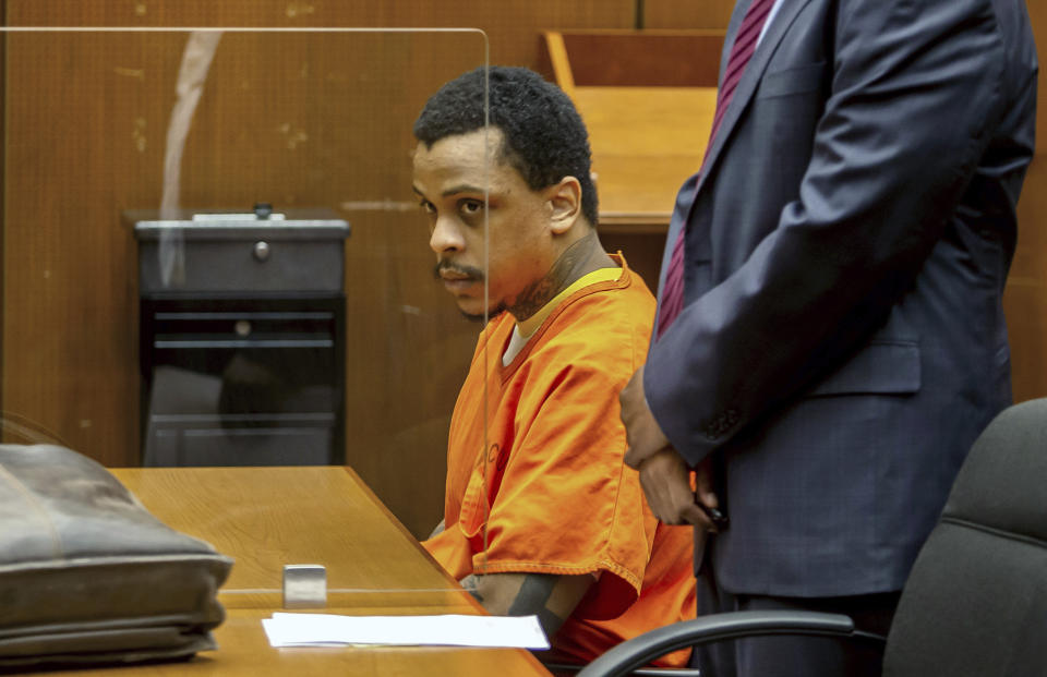 FILE - Eric Holder Jr. sits in the courtroom at Clara Shortridge Foltz Criminal Justice Center on Sept. 15, 2022, in Los Angeles. Holder Jr., who was convicted last year of fatally shooting rapper Nipsey Hussle in 2019, is scheduled to be sentenced Wednesday, Feb. 22, 2023, in a Los Angeles courtroom (Apu Gomes/Pool Photo via AP, File)