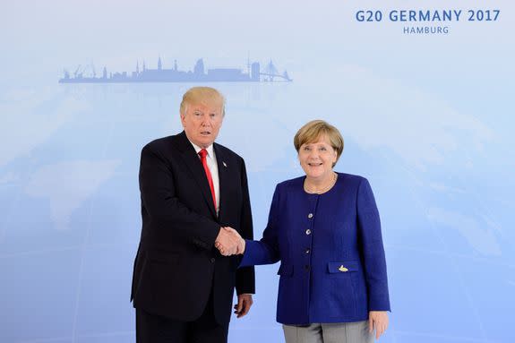 HAMBURG, GERMANY - JULY 06: German Chancellor Angela Merkel receives U.S. President Donald Trump in the Hotel Atlantic, on the eve of the G20 summit, for bilateral talks on July 6, 2017 in Hamburg, Germany. Leaders of the G20 group of nations are meeting for the July 7-8 summit. Topics high on the agenda for the summit include climate policy and development programs for African economies.  (Photo by Jens Schluter - Pool/Getty Images)