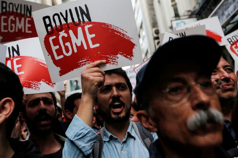 FILE PHOTO: People take part in a protest against a Turkish court decision that sentenced philanthropist Osman Kavala to life in prison over trying to overthrow the government in Istanbul, Turkey, April 26