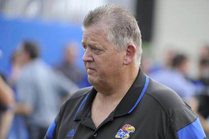 Charlie Weis was let go from Kansas on Sunday after a 2-2 start. (USA Today)