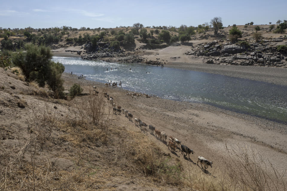 A general view of the banks of the Tekeze River, on the Sudan-Ethiopia border after Ethiopian forces blocked Tigrayan refugees from crossing into Sudan, in Hamdayet, eastern Sudan, Tuesday, Dec. 15, 2020. Ethiopia is at left, and Sudan is on the right. (AP Photo/Nariman El-Mofty)