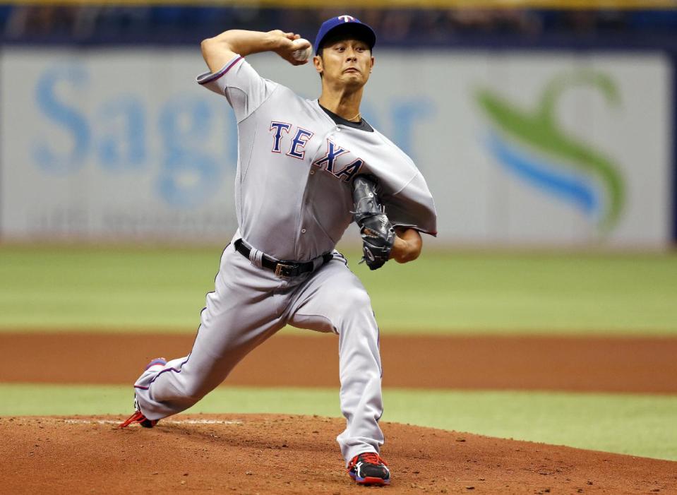 Texas Rangers starting pitcher Yu Darvish throws during the first inning of a baseball game against the Tampa Bay Rays, Sunday, April 6, 2014, in St. Petersburg, Fla. (AP Photo/Mike Carlson)