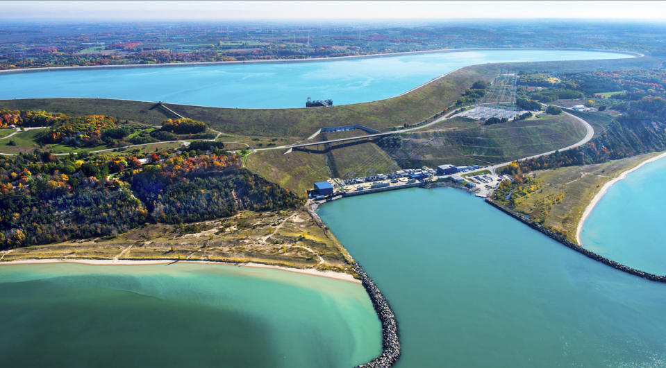 This undated photo provided by Consumers Energy shows an aerial view of the Ludington Pumped Storage Plant near Ludington, Mich. The plant generates electricity by pumping water from Lake Michigan to a reservoir on top of a bluff, then releasing it through giant turbines as needed. Advocates of pumped storage call such facilities the "world's largest batteries." (AP Photo/Consumers Energy)