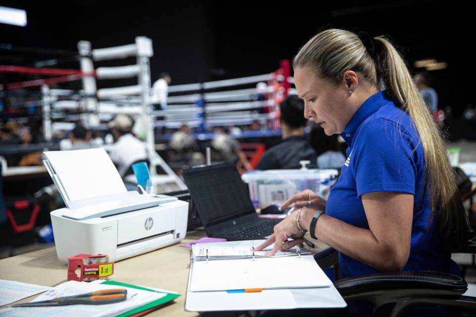 STABA Secretary Sabrina Luis takes stats during the Junior Olympic boxing tournament at the American Bank Center in Corpus Christi, Texas, Friday, June 10, 2022.