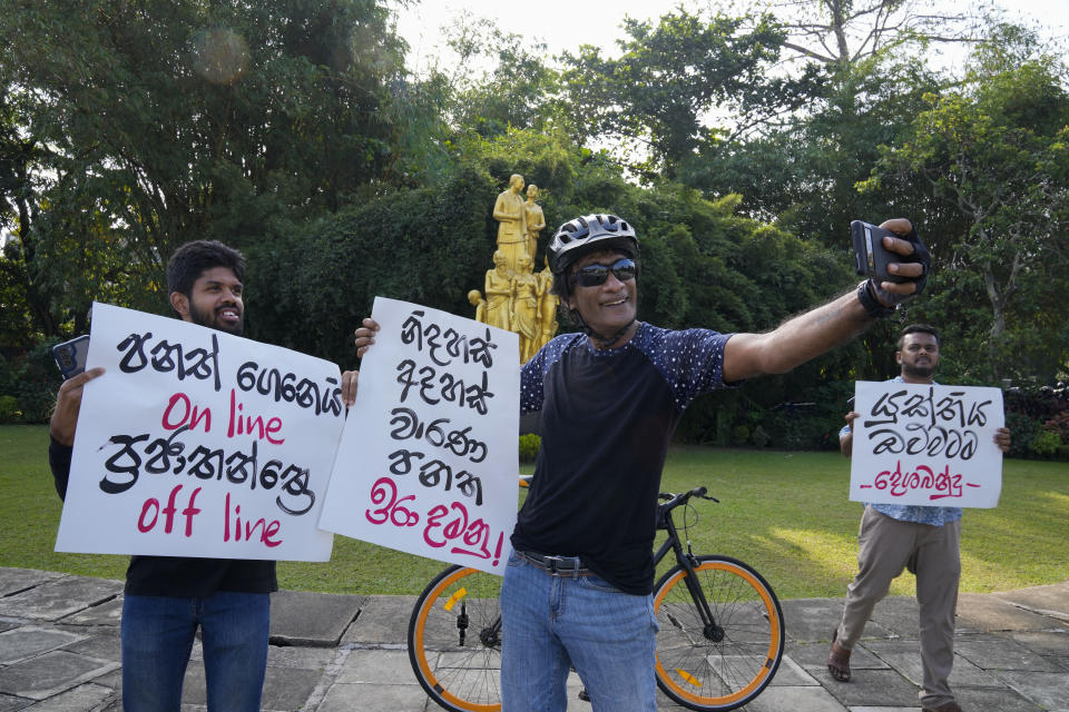 Sri Lankan social media activists hold placards with slogans against the proposed Online Safety Bill during a protest near the Parliament in Colombo, Sri Lanka, Tuesday, Jan. 23, 2024. (AP Photo/Eranga Jayawardena)