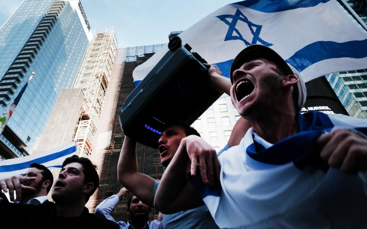 Supporters of Israel protest in New York City's Times Square - Spencer Platt /Getty Images North America 