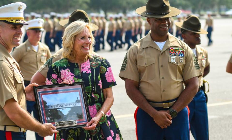 First Lady Jill Biden is given a ceremonial framed photo after speaking at the graduation ceremony on Friday June 30, 2023 at Marine Corps Recruit Depot Parris Island. The visit was part of a White House initiative started in 2011 by then First Lady Michelle Obama and Biden called Joining Forces to assist military members and their families through education, employment opportunities and wellness programs.