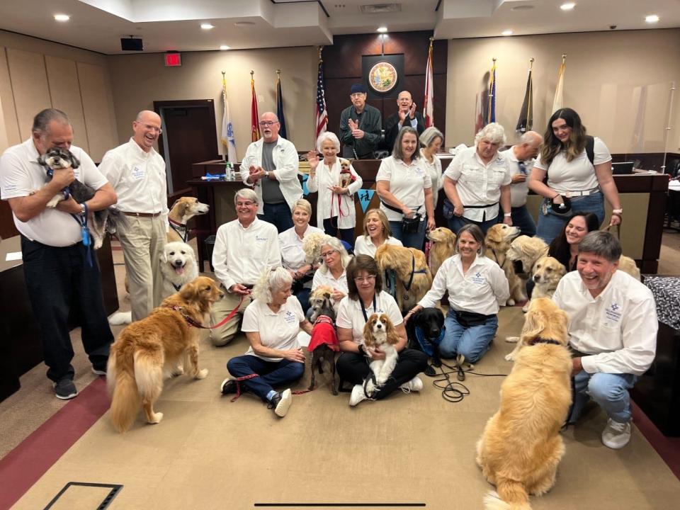 Second Circuit Judges Jimmy Hankinson and Jonathan Sjostrom pose with the newly sworn in canine teams.