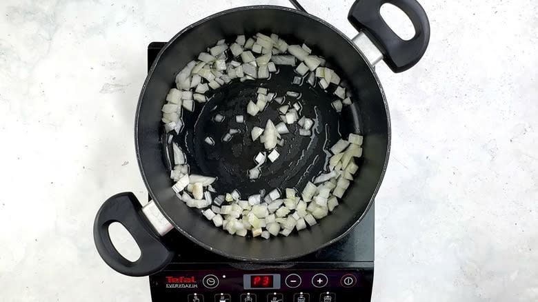 onion frying in pan