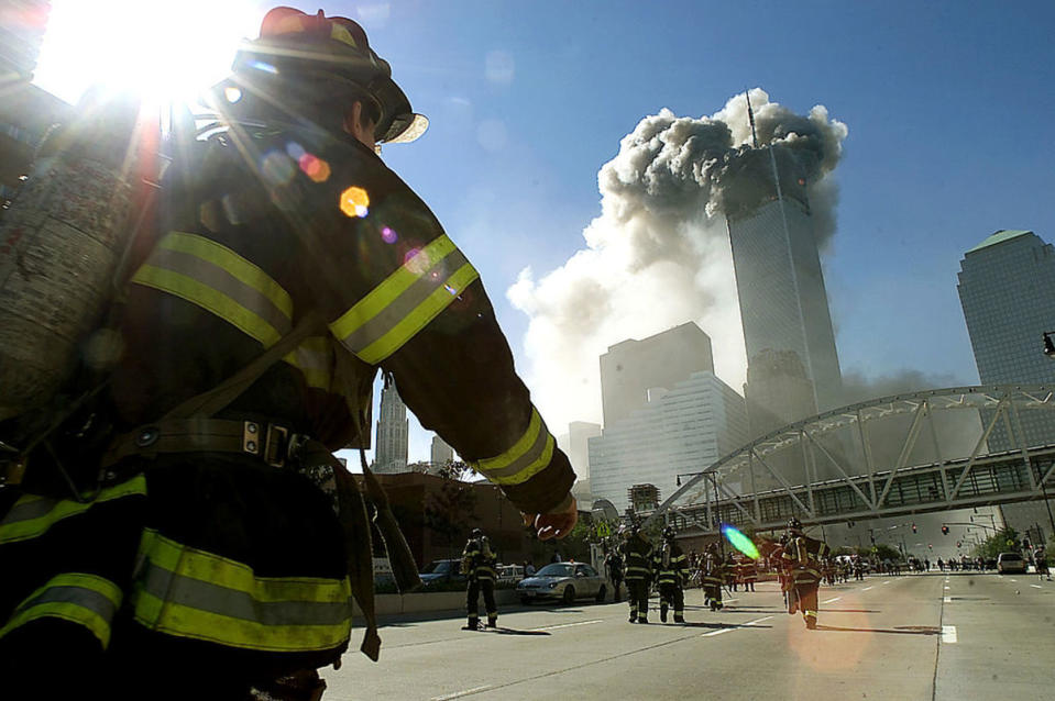 <p>Photo by Jose Jimenez/Primera Hora/Getty Images</p><p>Firefighters walk toward one of the towers at the World Trade Center before it collapsed after a plane hit the building on September 11, 2001 in New York City.</p>