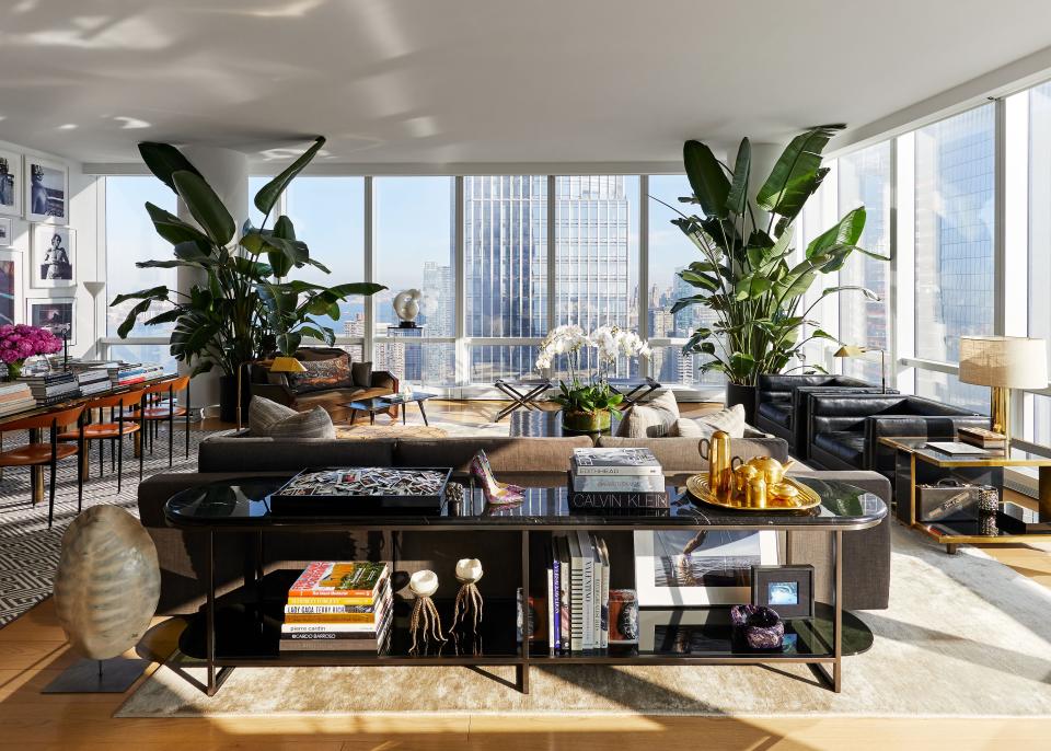 “I’m a high-class hoarder,” says Atwood, and the expansive living area showcases some of the many beautiful things he and Deutsch have acquired over the years. A Karen Pearse credenza displays a Tom Dixon tea set, some jellyfish candles found on vacation in Capri, and a pair of Atwood shoes designed as a collaboration with Arizona Iced Tea to celebrate that brand’s 25th anniversary. Another keepsake? A tray of Polaroids the couple has taken of dinner and party guests over the years.