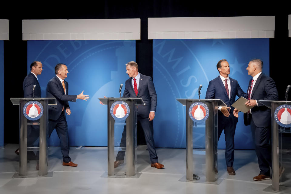 From left, JR Bird, John Dougall, Mike Kennedy, Case Lawrence and Stewart Peay, candidates in the Republican primary for Utah's 3rd Congressional District, shake hands after taking part in a televised debate at the Eccles Broadcast Center on Wednesday, June 12, 2024, in Salt Lake City. (Spenser Heaps/The Deseret News via AP, Pool)