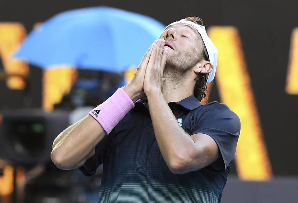 France's Lucas Pouille celebrates after defeating Canada's Milos Raonic in their quarterfinal match at the Australian Open tennis championships in Melbourne, Australia, Wednesday, Jan. 23, 2019. (AP Photo/Andy Brownbill)