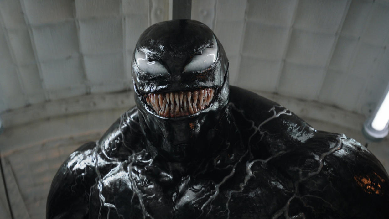  A humanoid creature covered in a thick black goo-like substance with a mouth full of long, sharp teeth. 