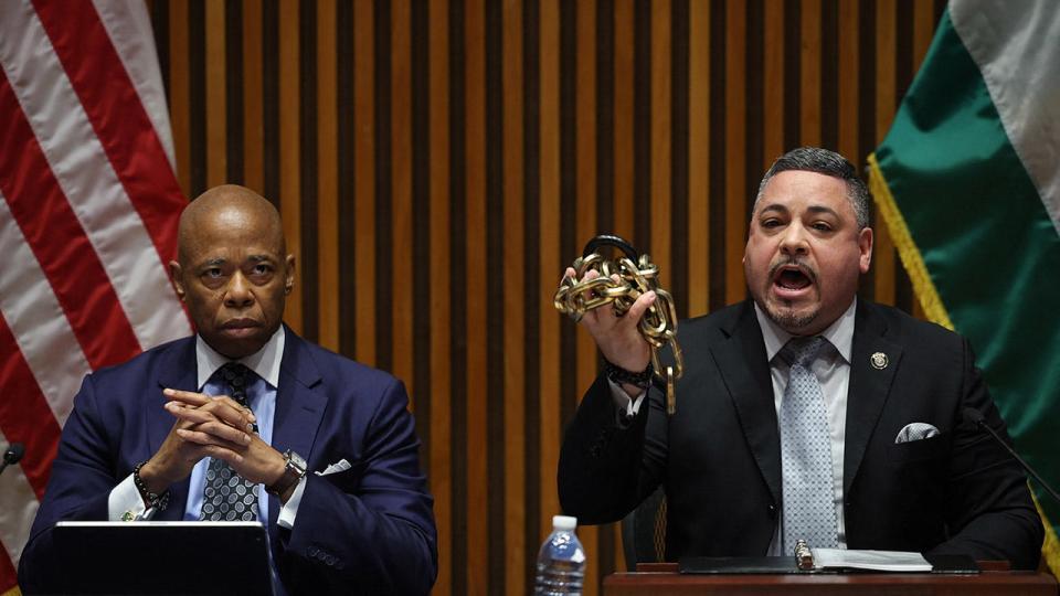NYPD Commissioner Edward Caban, right, and Mayor Eric Adams appear at a press conference as Caban holds up chains and a lock removed by officers during their operation to clear protestors from Columbia University on May 1, 2024.