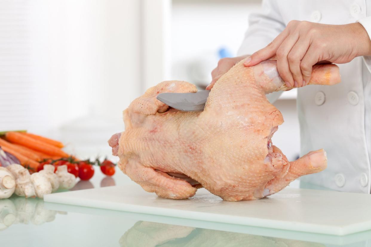 chef breaking up bird