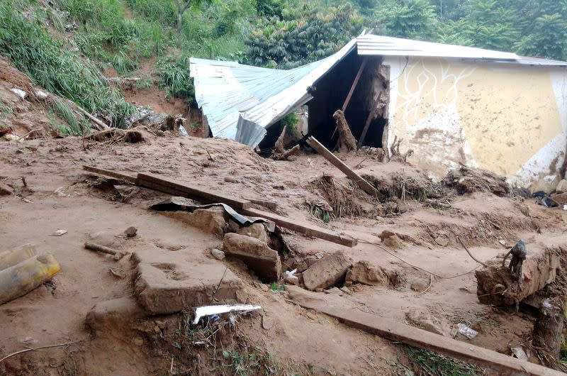 A damaged house is seen after heavy rains caused floods and landslides, on the outskirts of Kinshasa