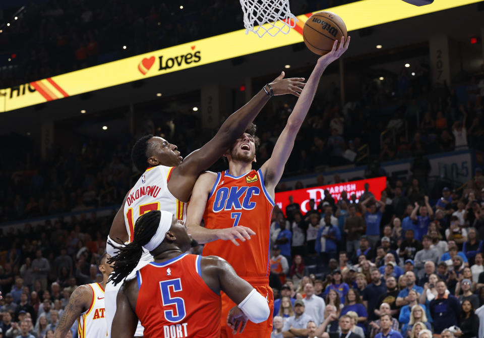 Nov 6, 2023; Oklahoma City, Oklahoma, USA; Oklahoma City Thunder forward <a class="link " href="https://sports.yahoo.com/nba/players/6692" data-i13n="sec:content-canvas;subsec:anchor_text;elm:context_link" data-ylk="slk:Chet Holmgren;sec:content-canvas;subsec:anchor_text;elm:context_link;itc:0">Chet Holmgren</a> (7) is fouled on the way to the basket by Atlanta Hawks forward <a class="link " href="https://sports.yahoo.com/nba/players/6398" data-i13n="sec:content-canvas;subsec:anchor_text;elm:context_link" data-ylk="slk:Onyeka Okongwu;sec:content-canvas;subsec:anchor_text;elm:context_link;itc:0">Onyeka Okongwu</a> (17) during the second half at Paycom Center. Oklahoma City won 126-117. Mandatory Credit: Alonzo Adams-USA TODAY Sports